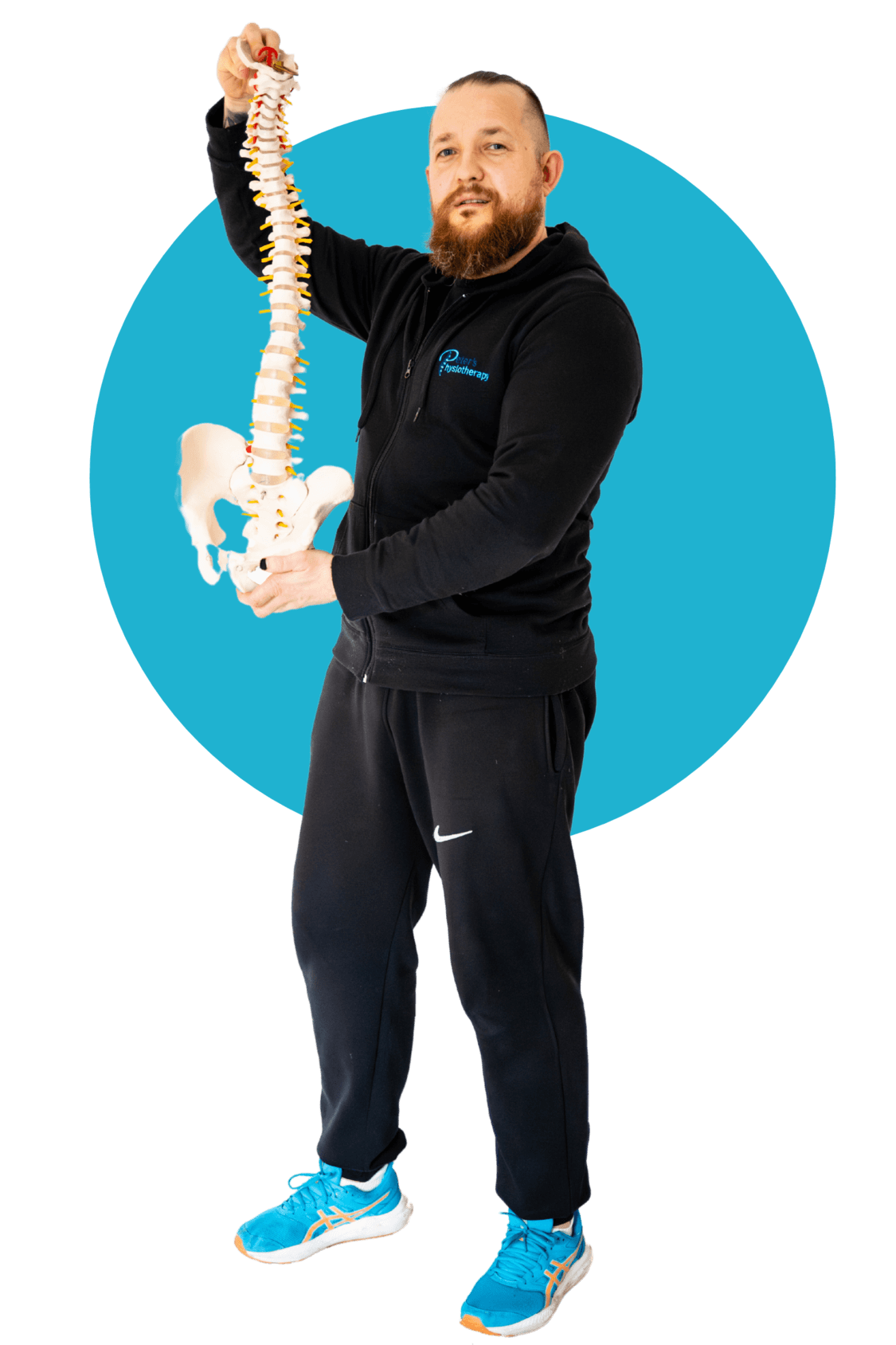 Glasgow-based physiotherapist holding a spinal model to demonstrate spine health