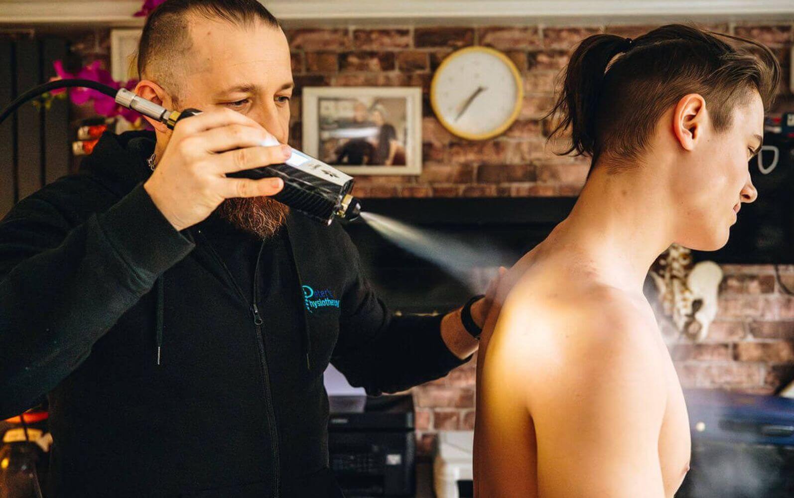 Cryotherapy spray applied to shoulder at Private Physiotherapy Glasgow Clinic