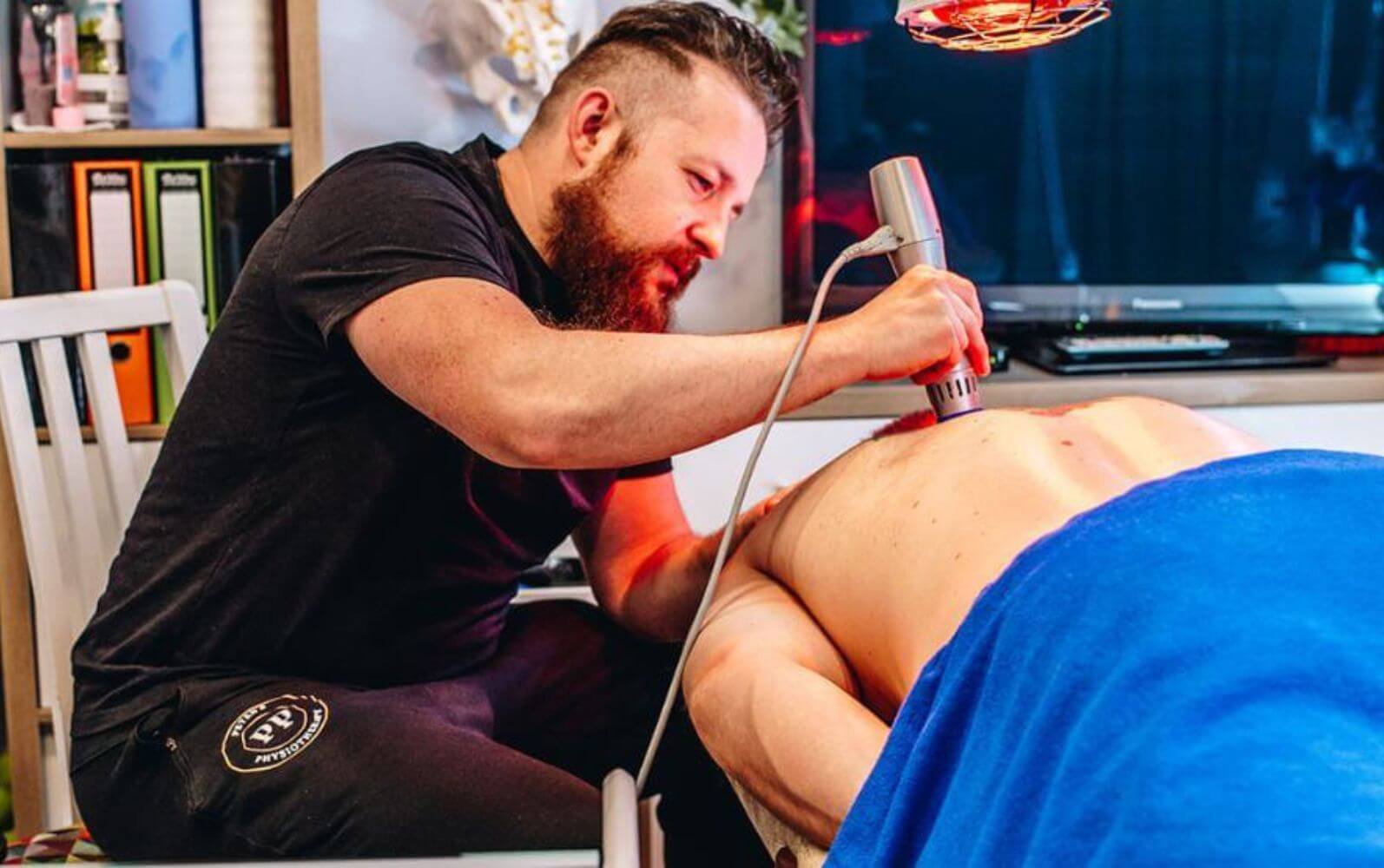 Shockwave therapy treatment on back at Private Physiotherapy Glasgow Clinic